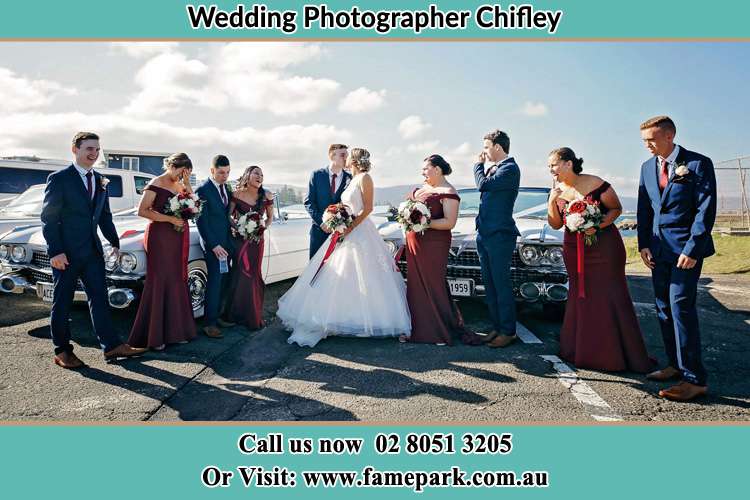 Photo of the Groom and the Bride with the entourage at the parking lot Chifley NSW 2036