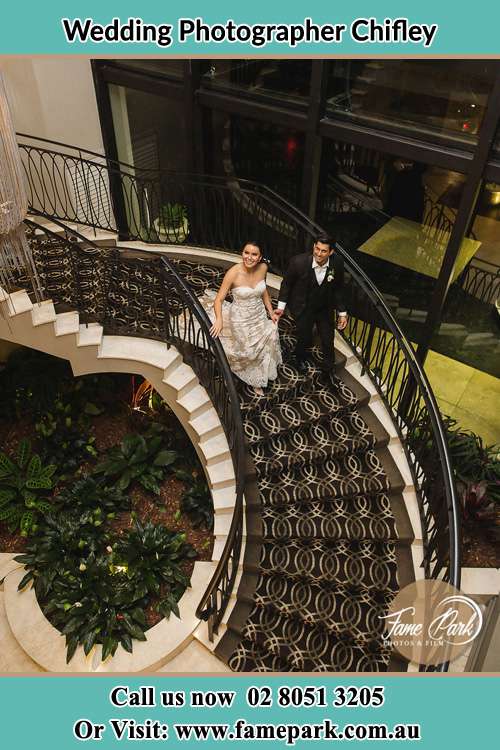 Photo of the Bride and the Groom going down the stair Chifley NSW 2036