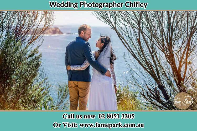 Photo of the Groom and the Bride looking each other near the sea front Chifley NSW 2036