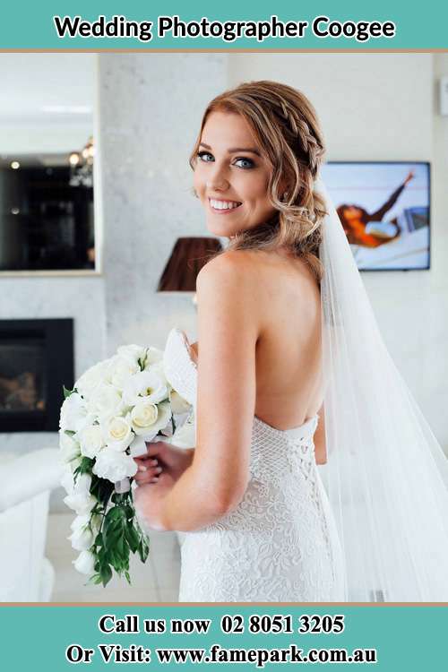 The Bride holding a bouquet of flower smiling on the camera Coogee NSW 2034