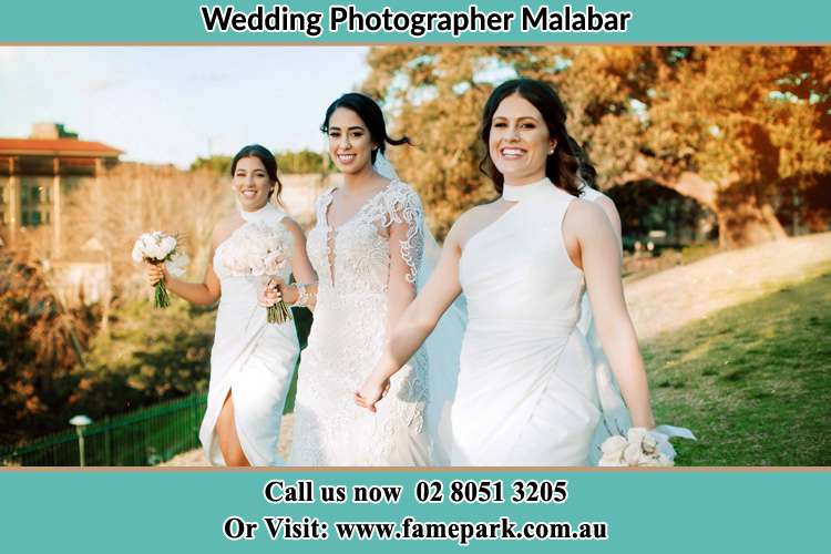 Photo of the Bride and the bridesmaids walking Malabar NSW 2036