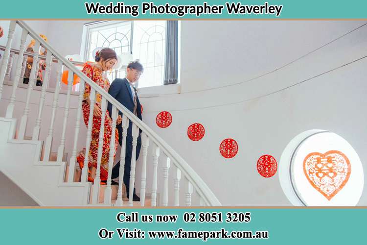 Photo of the Bride and the Groom going down the stair Waverley NSW 2024