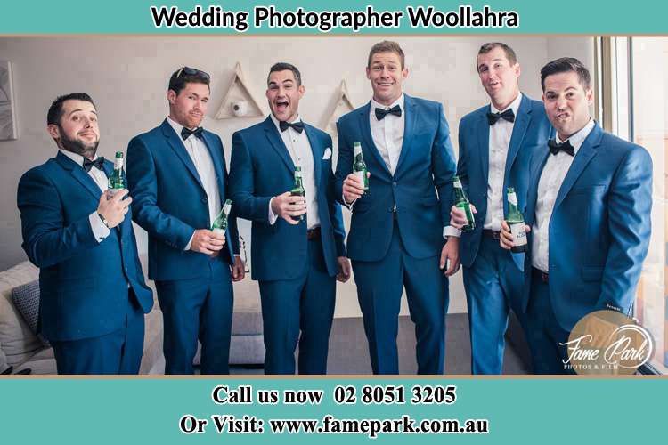 The groom and his groomsmen striking a wacky pose in front of the camera Woollahra NSW 2025